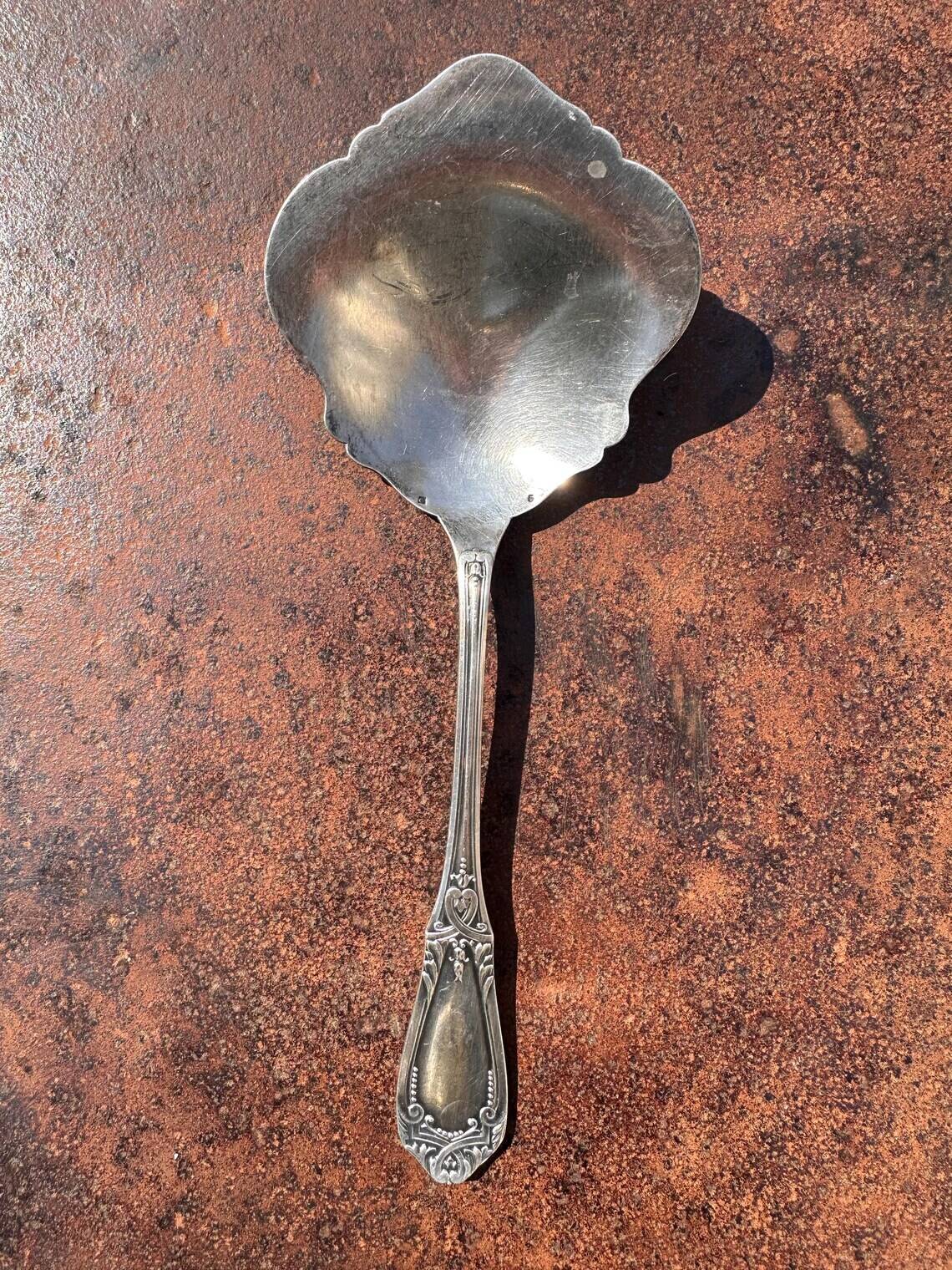 Strawberry spoon or antique Art Nouveau fruit salad in silver metal.