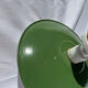 Antique wall lamp with an enamelled metal shade and porcelain.