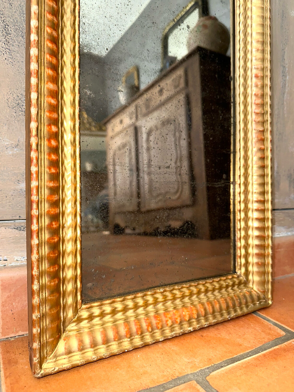 Antique gilded mirror from the Directoire period, 19th century.
