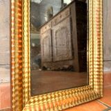 Antique gilded mirror from the Directoire period, 19th century.