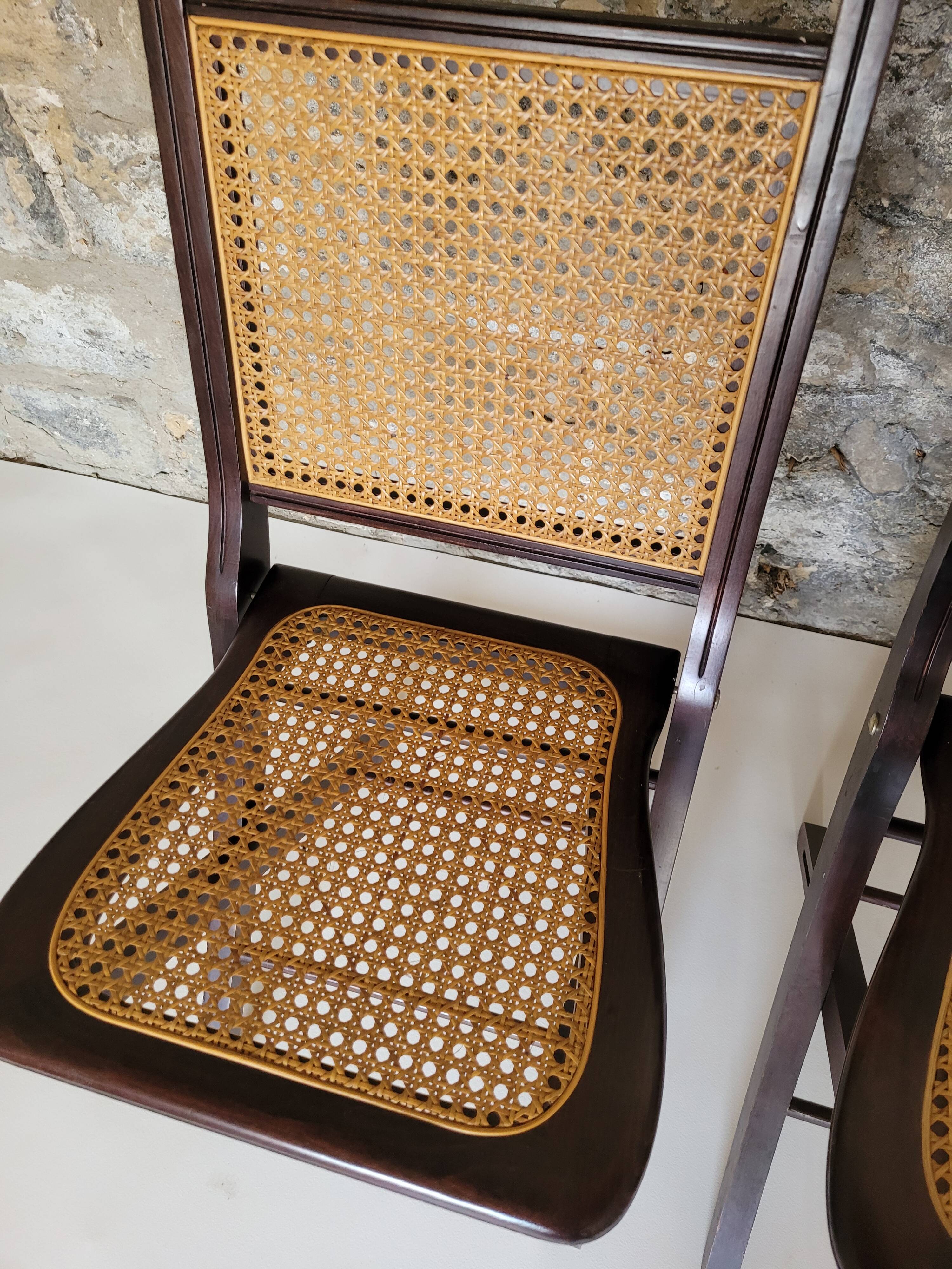 Pair of folding cane chairs