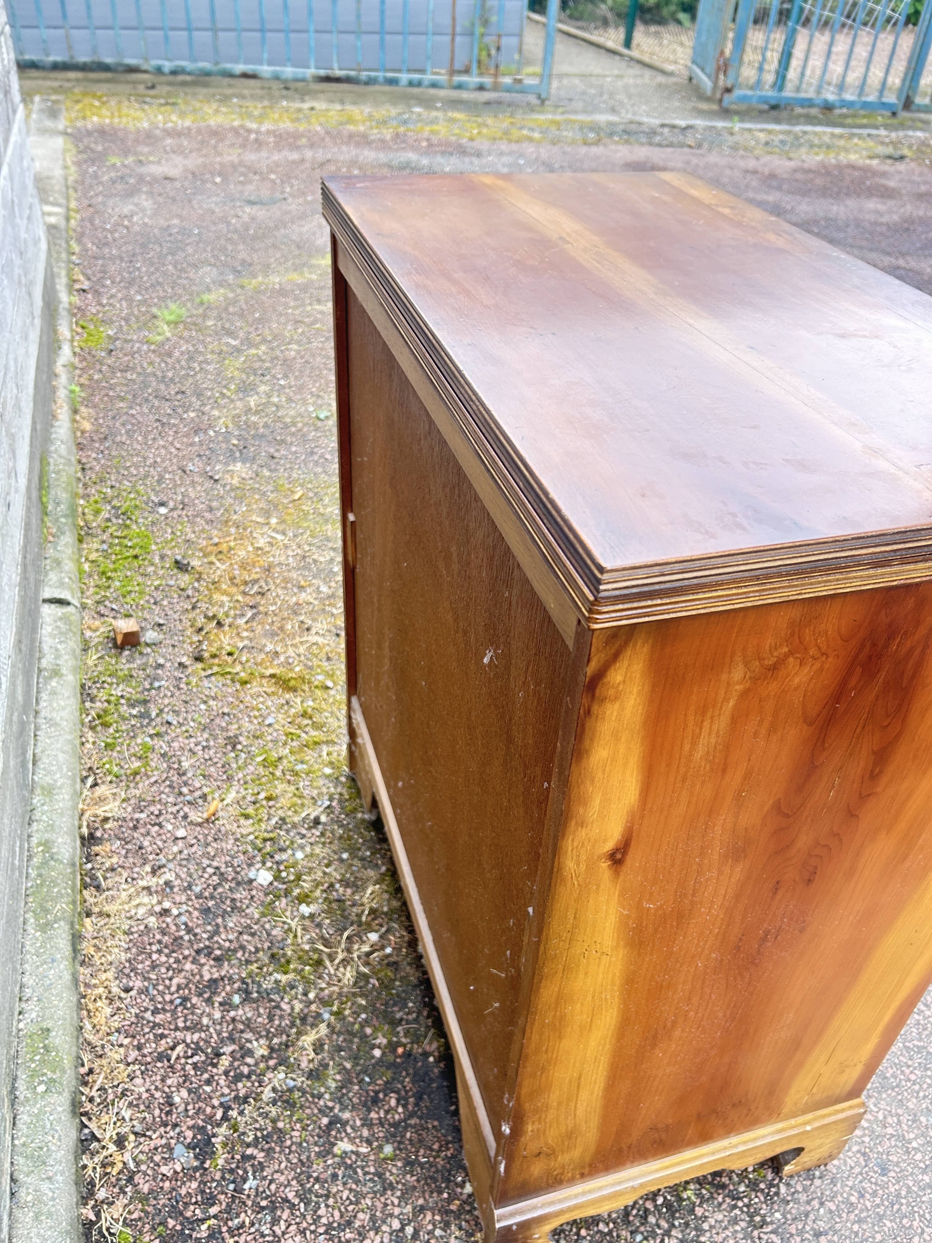 Small English chest of drawers with a folding top.