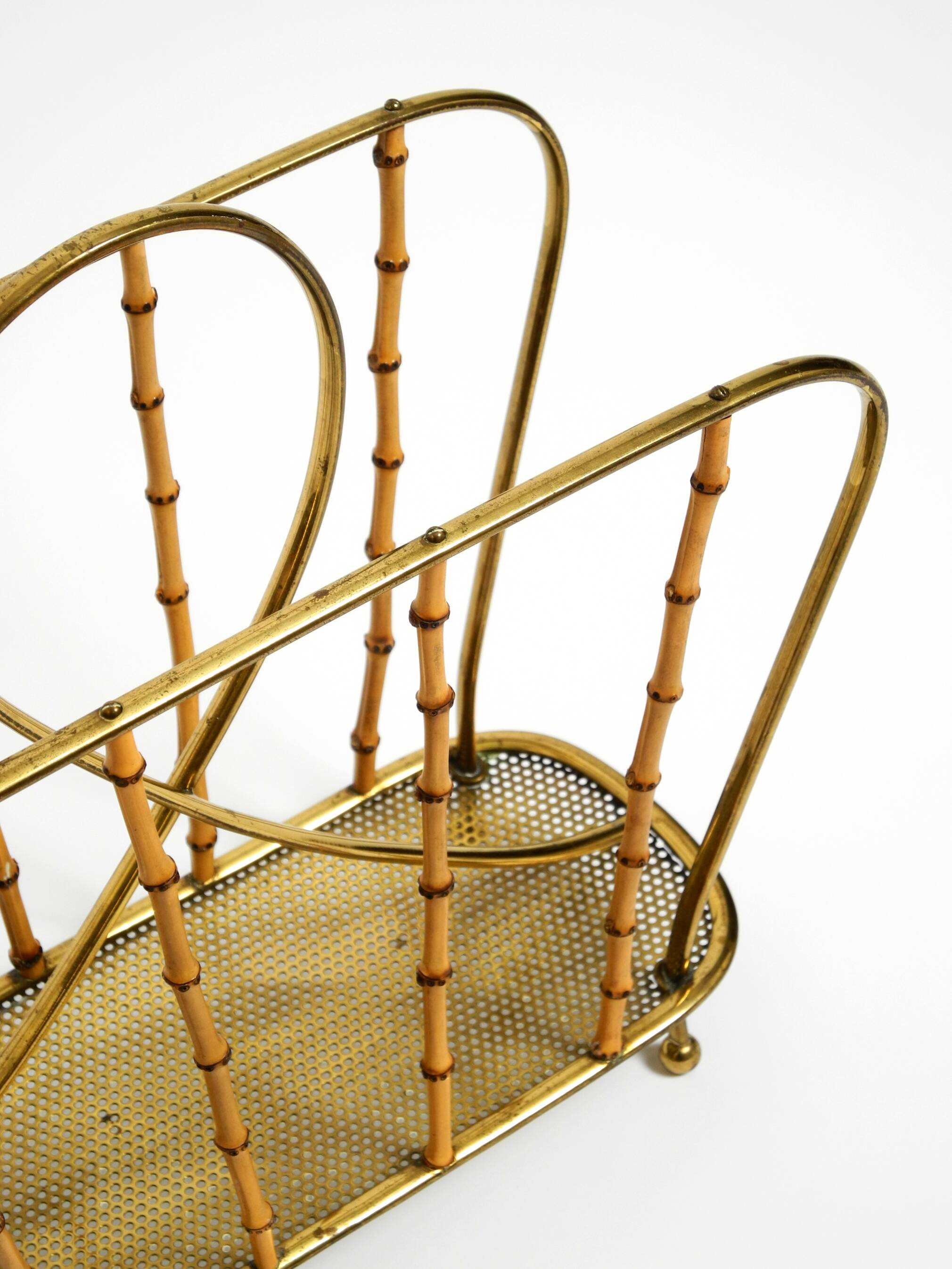Rare Mid Century Modern magazine rack made of solid brass and genuine bambo
