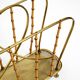 Rare Mid Century Modern magazine rack made of solid brass and genuine bambo