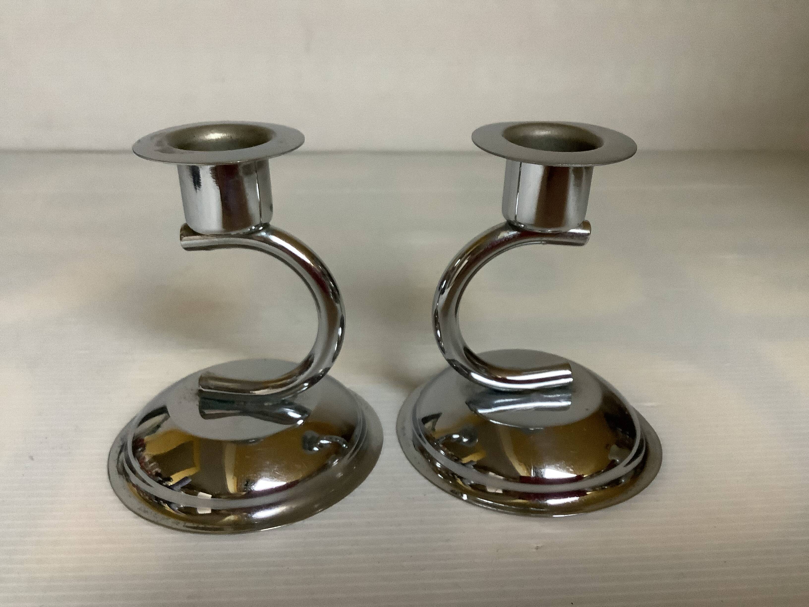 Pair of small silver metal candlesticks
