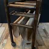 Vintage rattan magazine rack on wheels
