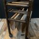 Vintage rattan magazine rack on wheels