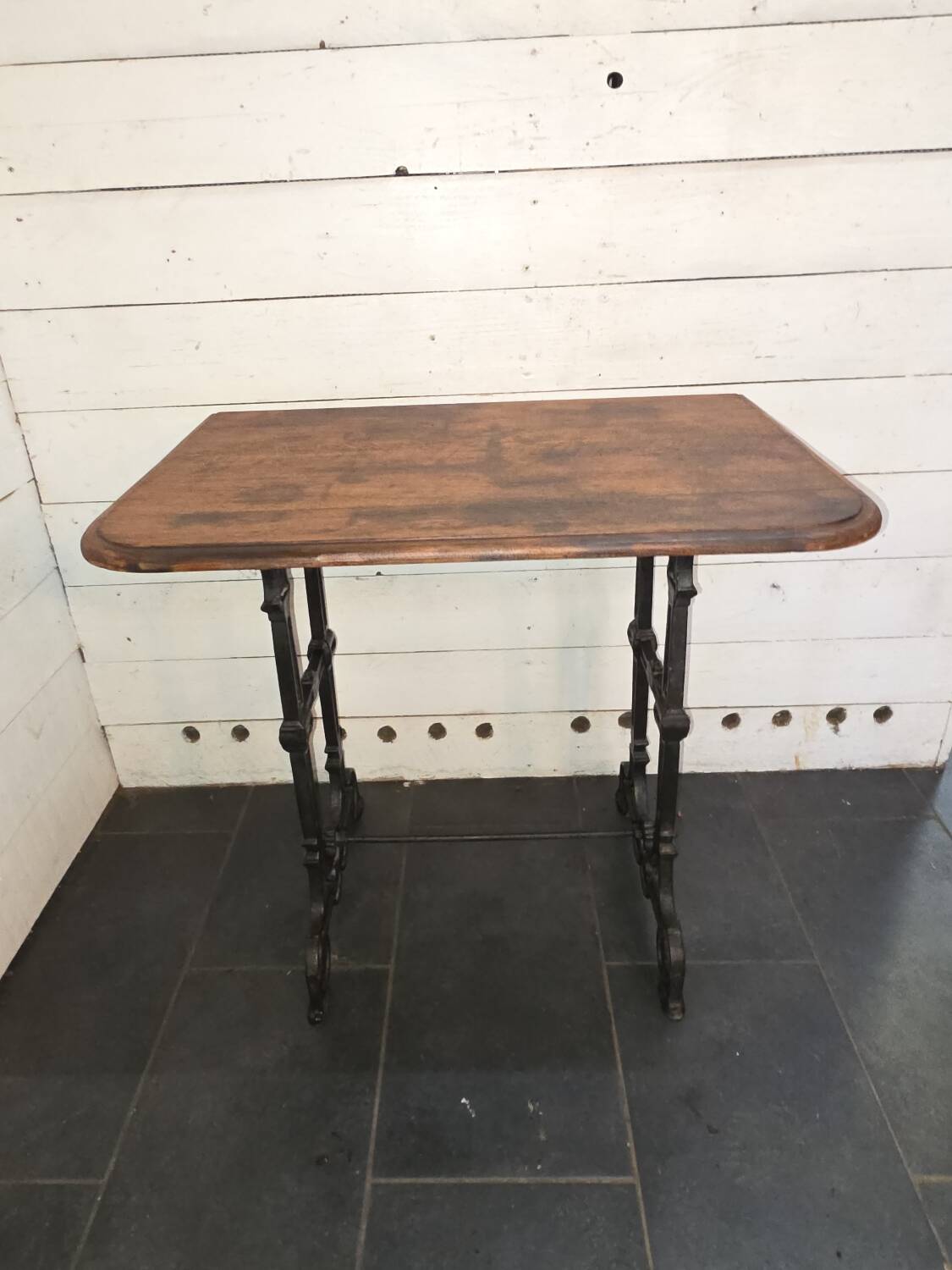 Bistro table with cast iron legs and oak top