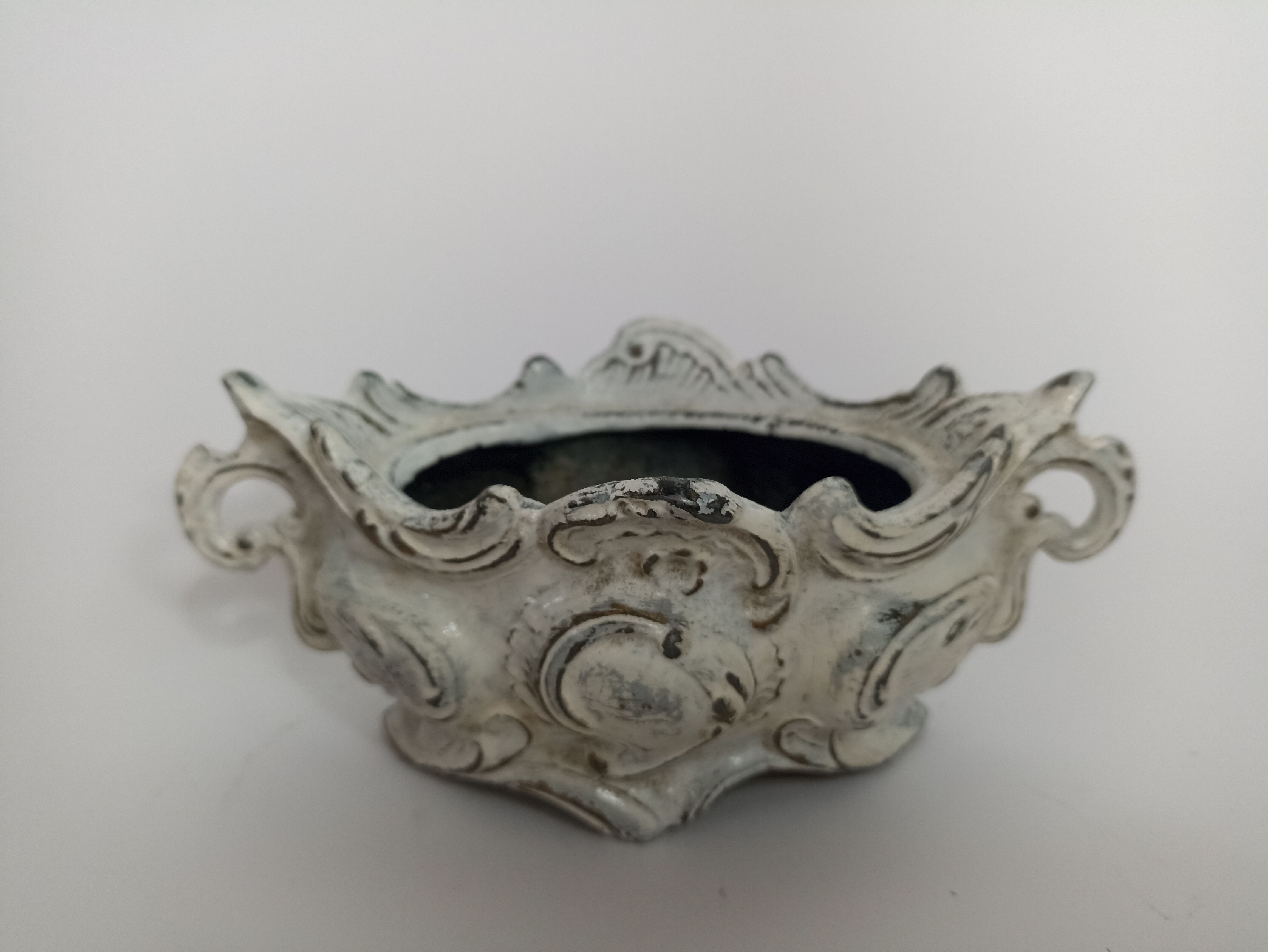 Old patinated cast iron planter