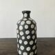 Terracotta vase painted with polka dots