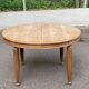Large stripped solid oak dining table in Louis XVI style with 3 extensions.