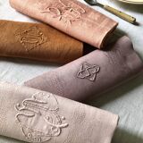 Set of four old damask towels dyed in multiple colors