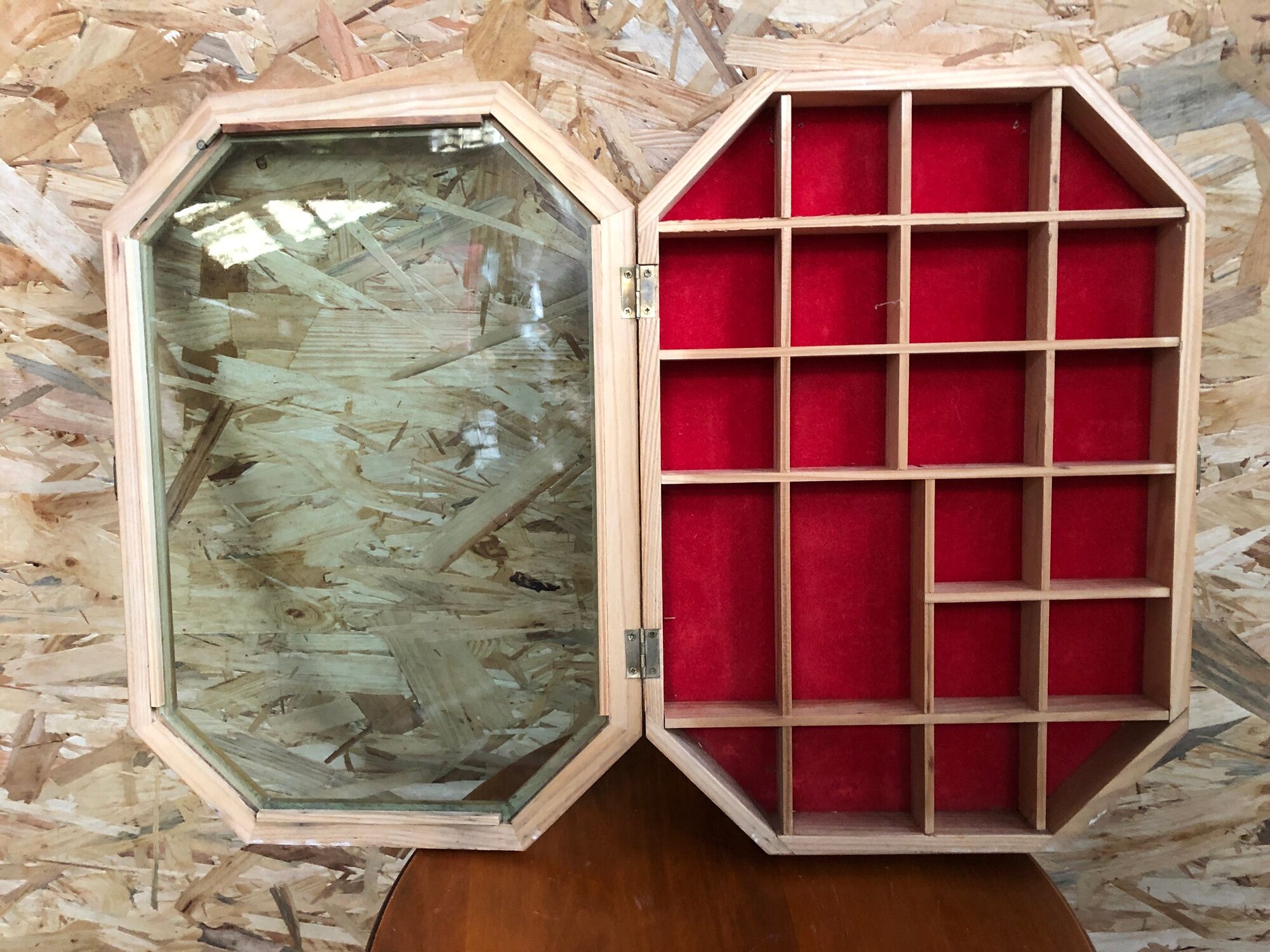 Old hanging showcase 22 wooden boxes red background