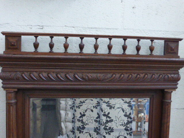 Large mirror beveled Henri II style varnished and carved wooden 128 x 92 cm