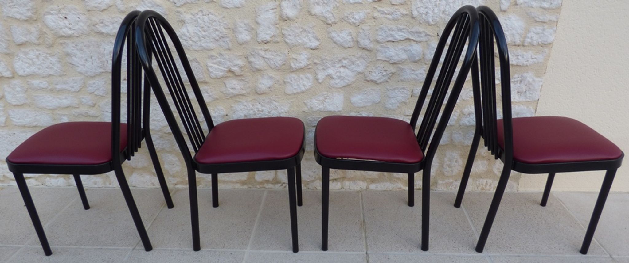 4 metal chairs with burgundy imitation leather seats from the Souvignet brand