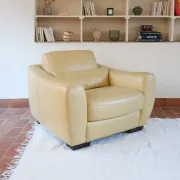 Vintage club armchair in butter yellow faux leather from the 1980s.