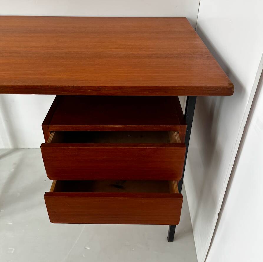 Vintage wooden and metal desk in modernist style.