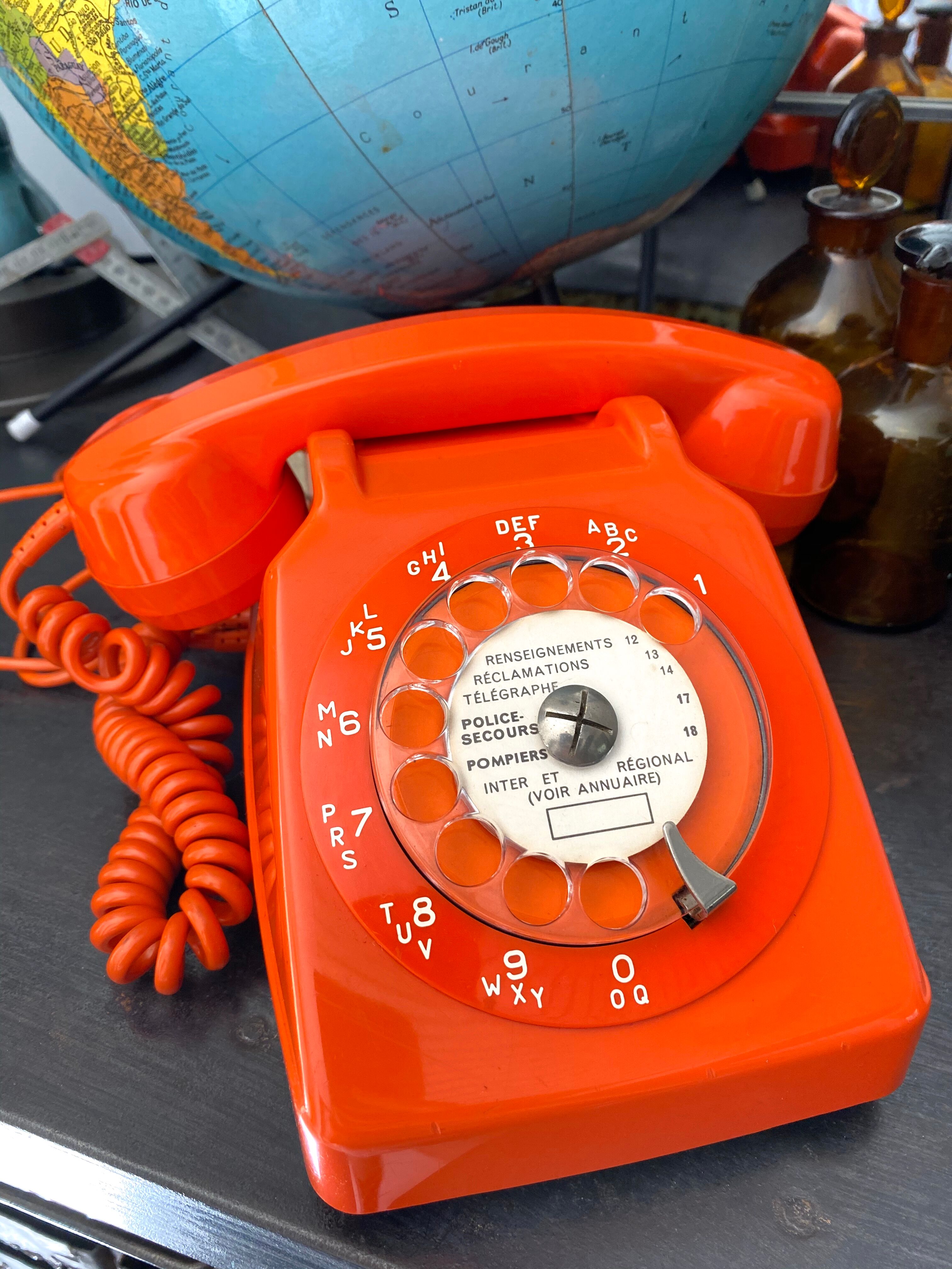 Orange vintage dial phone