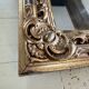 Miroir Louis XV, glace au mercure et bois doré, XIXe