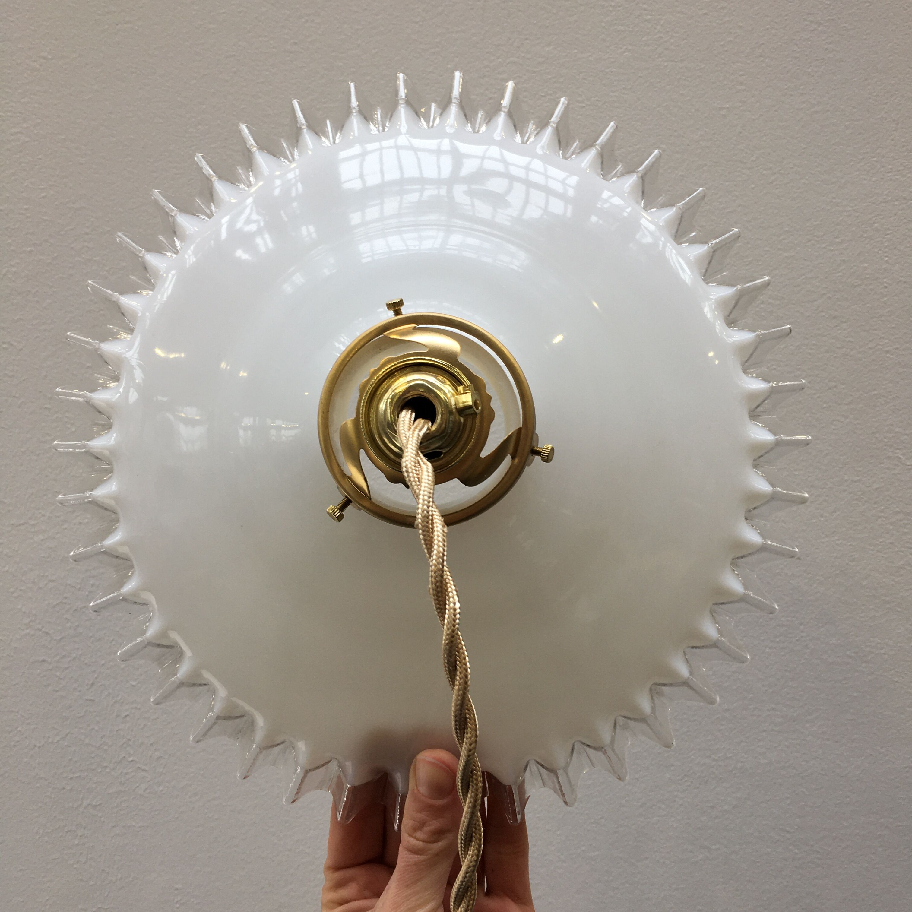 White opaline pendant lamp with transparent serrated edges