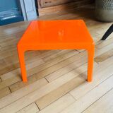 Small orange fiberglass side table from the 70s