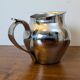 Antique stainless steel milk jug by Remy Letang