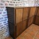 Modular corner library Oscar from the 1960s with sliding doors.