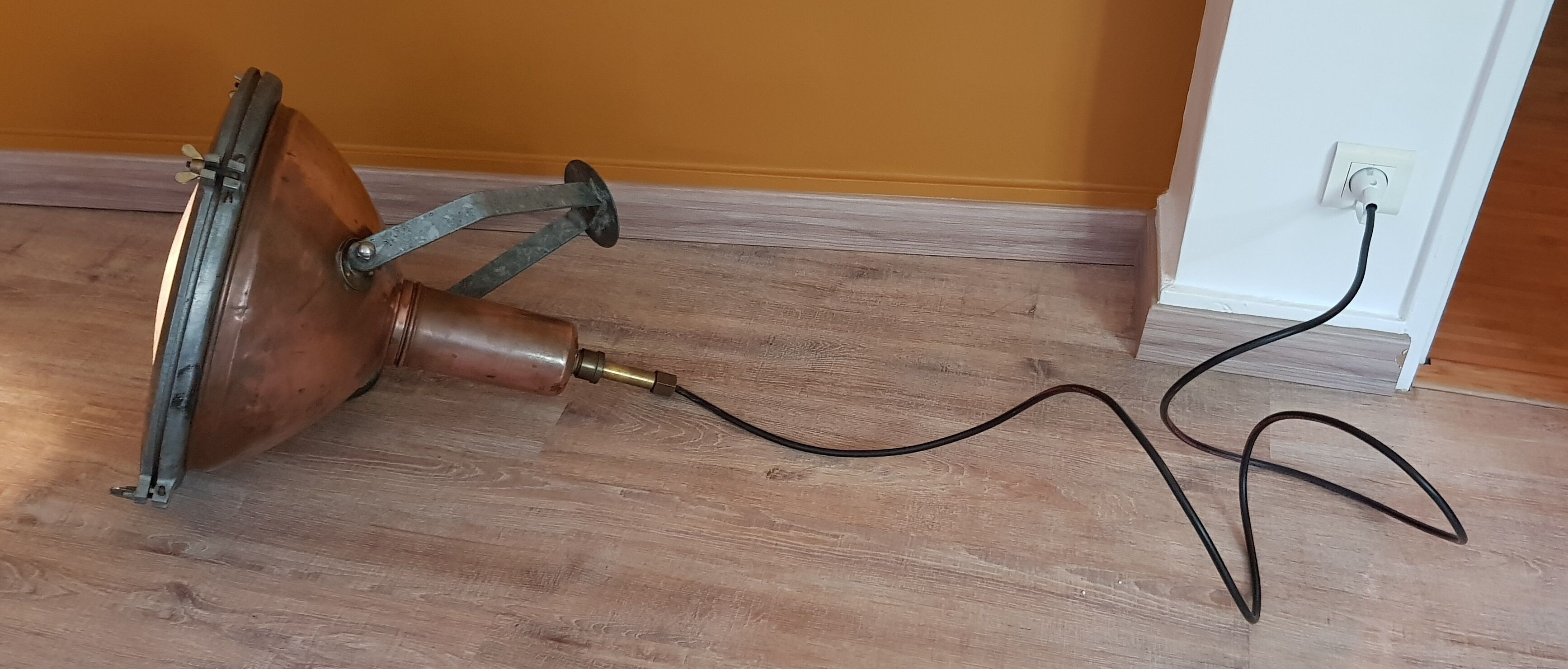 Old brass boat headlight with Holophane interior glass