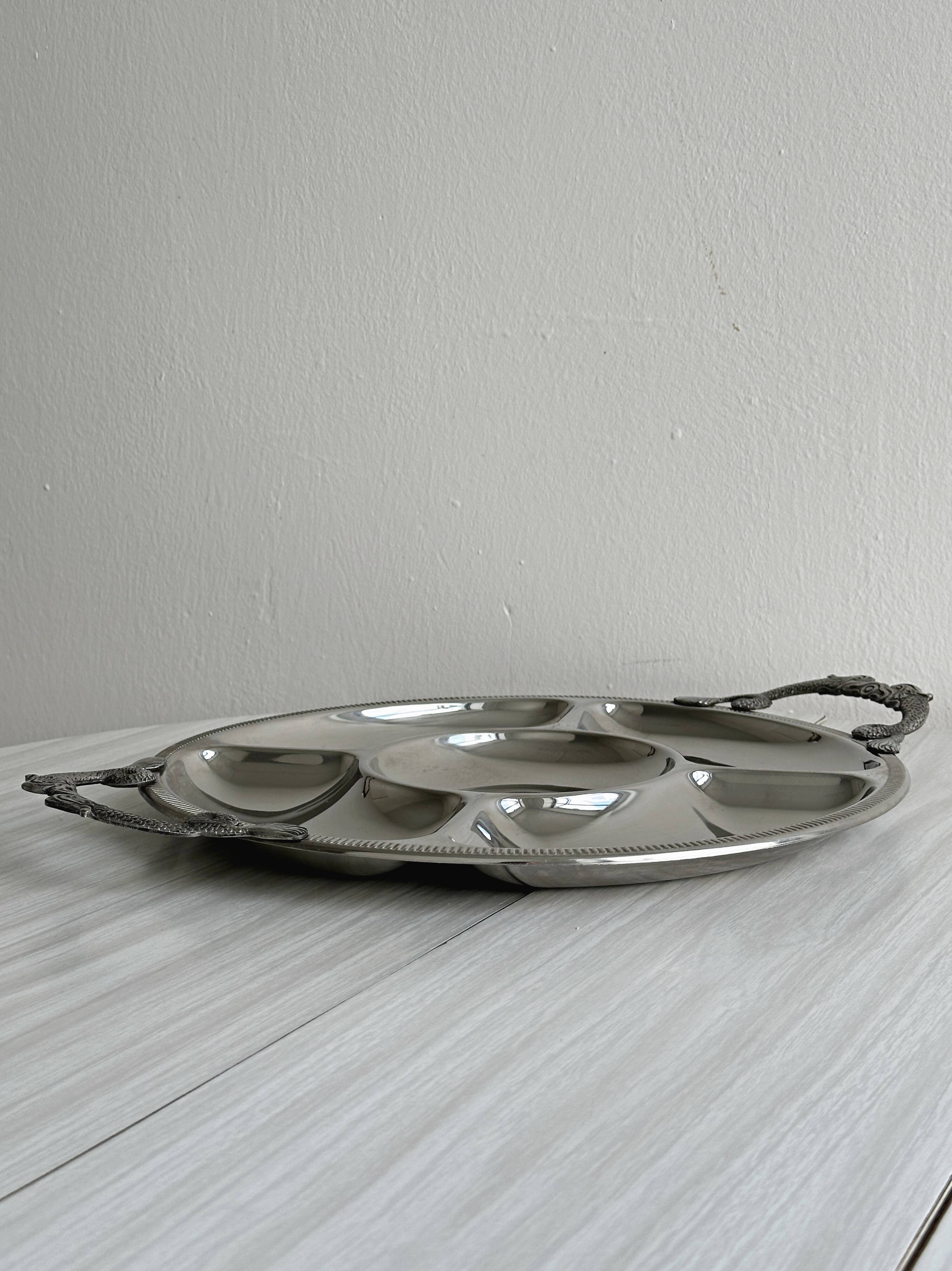 Vintage silver-plated metal serving tray with compartments.