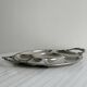 Vintage silver-plated metal serving tray with compartments.