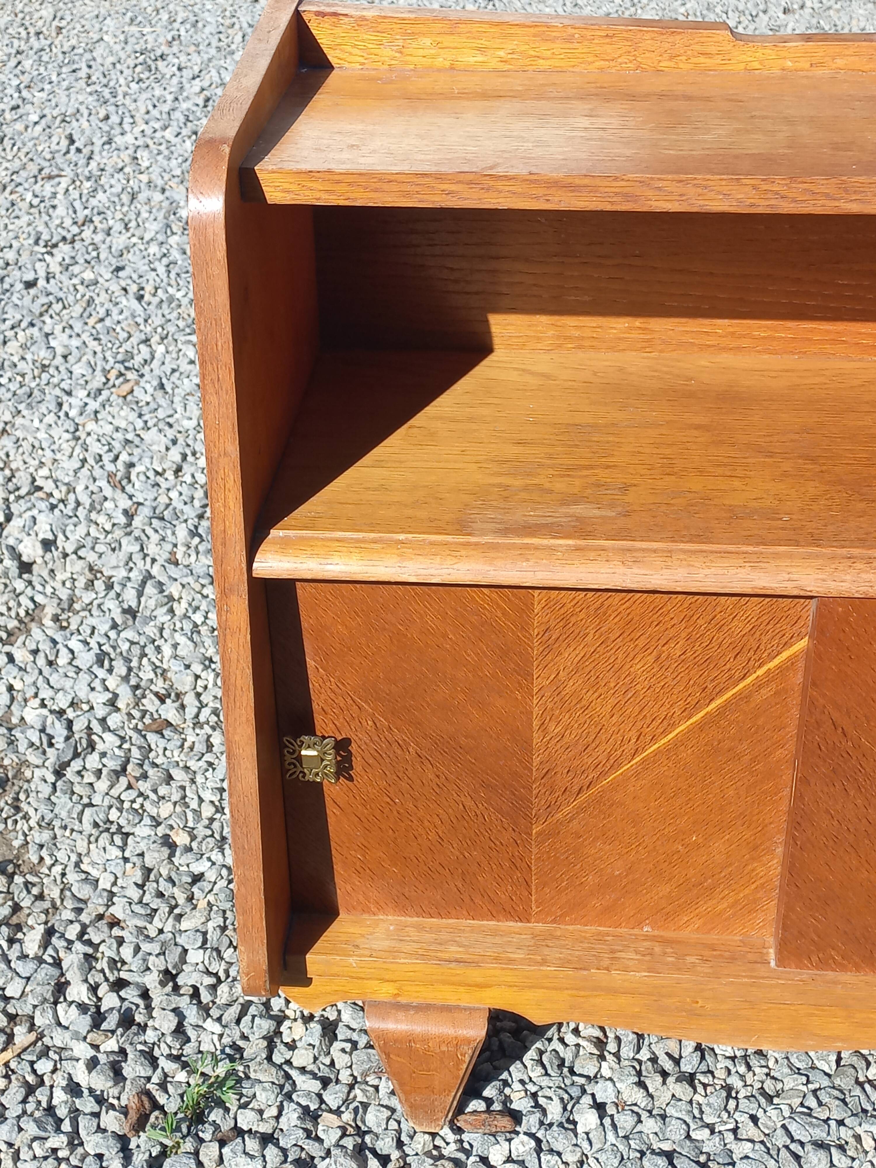 Vintage accent furniture in golden blonde oak with 2 sliding doors.