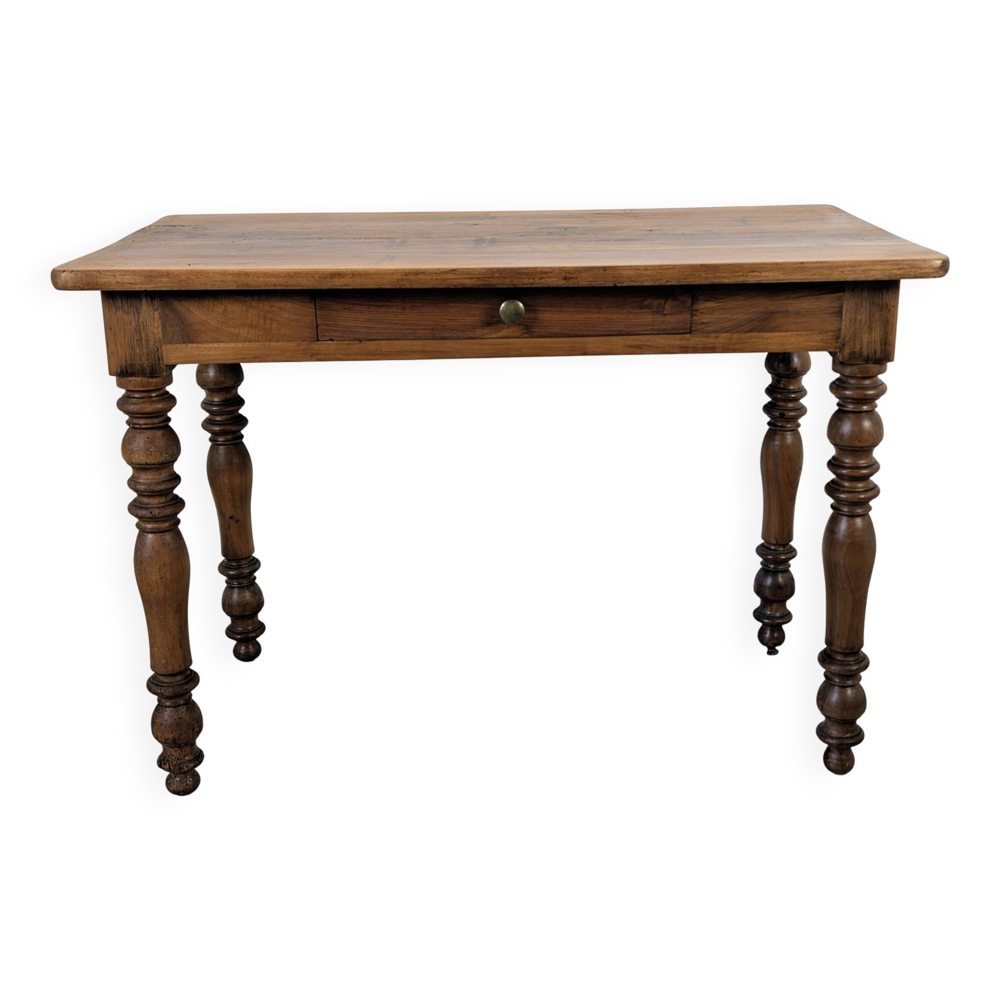 Antique writing table in the Napoleon III style with turned wooden legs.