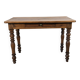 Antique writing table in the Napoleon III style with turned wooden legs.