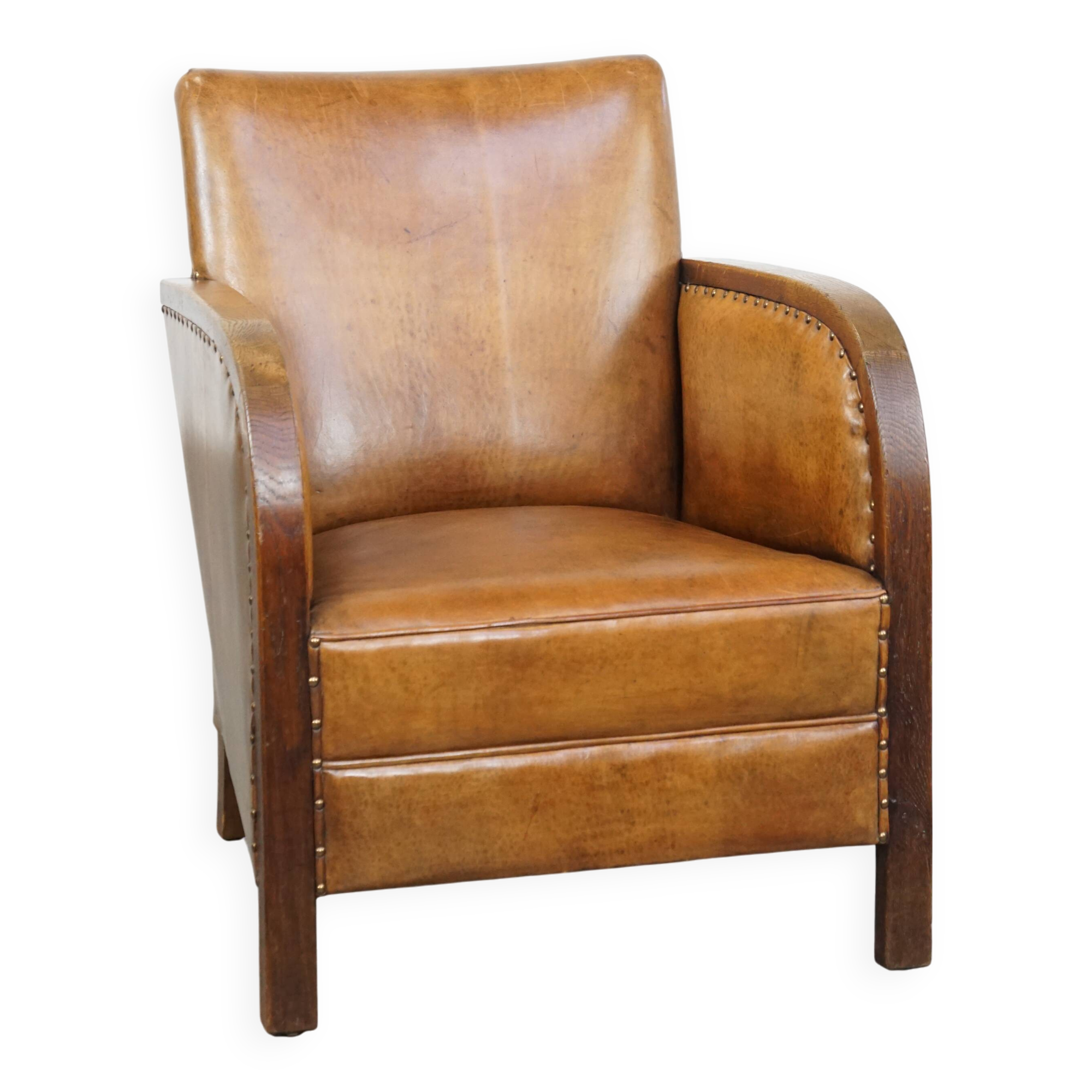 Cognac-colored sheepskin and wooden Art Deco design armchair