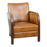 Cognac-colored sheepskin and wooden Art Deco design armchair