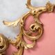 Italian rococo-style headboard in carved gilded wood, 19th century.