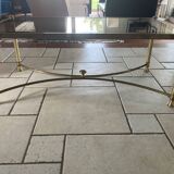 Coffee table in glass and gold metal