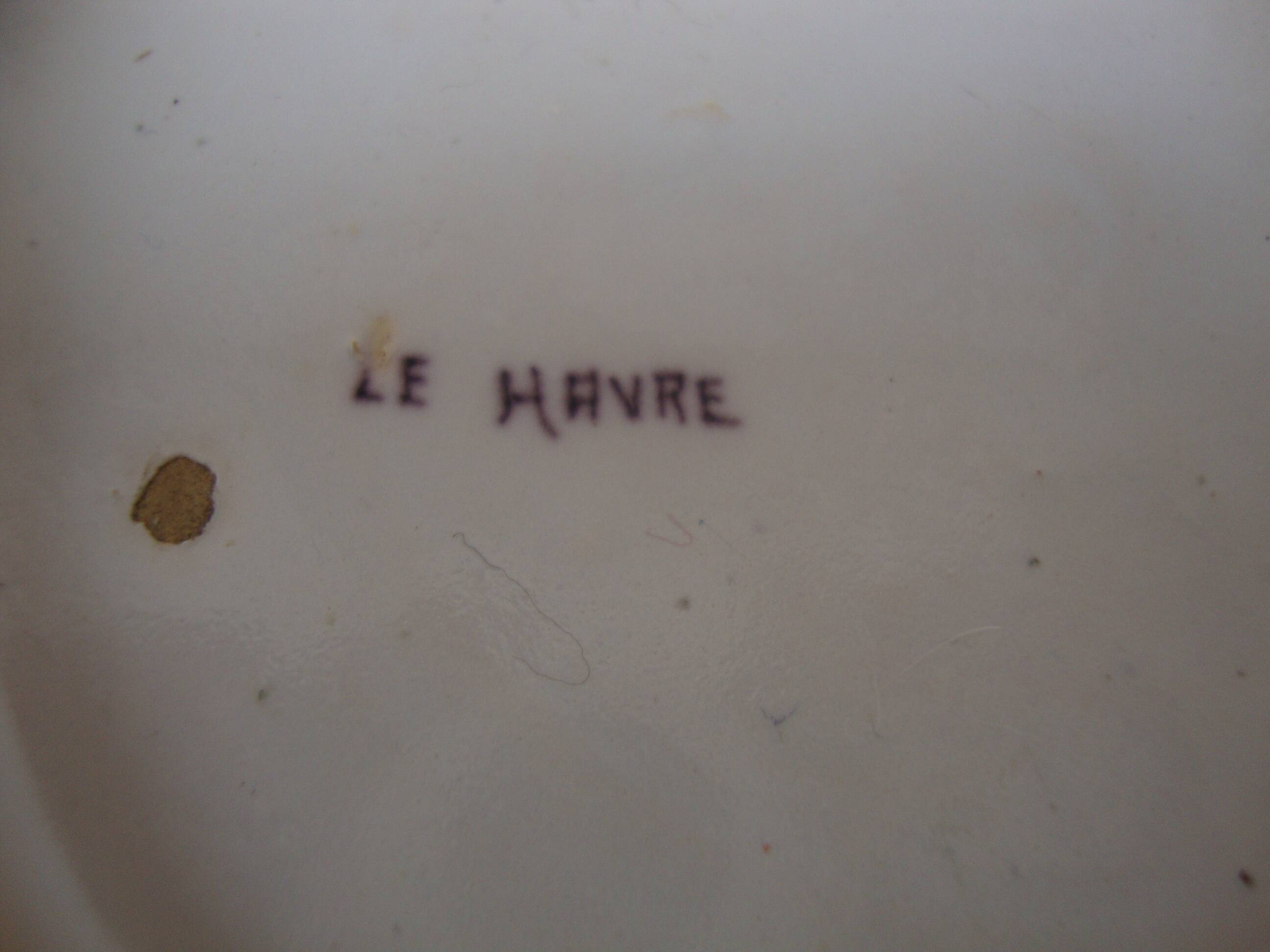 Old earthenware plate decorated with a character marked Le HAVRE
