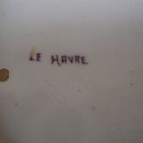 Old earthenware plate decorated with a character marked Le HAVRE