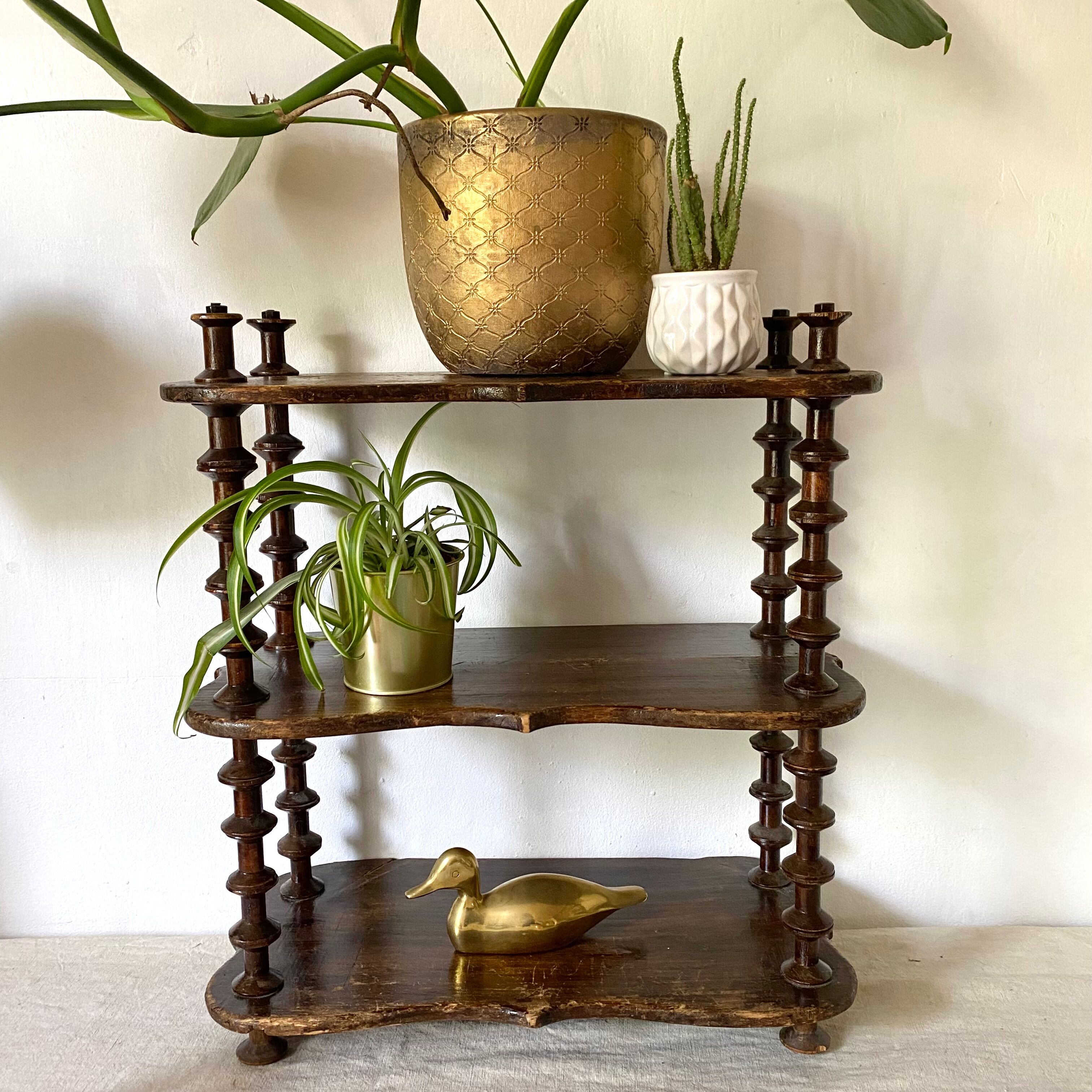 Old shelf in turned wood like reels