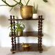Old shelf in turned wood like reels