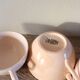 A set of 3 pink earthenware cups from Digoin Sarreguemines.