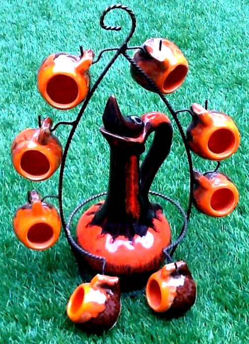 1960s-1970s liquor service including a decanter and 8 cups