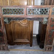 Old façade or decorative frame in carved wood, of Indian origin.