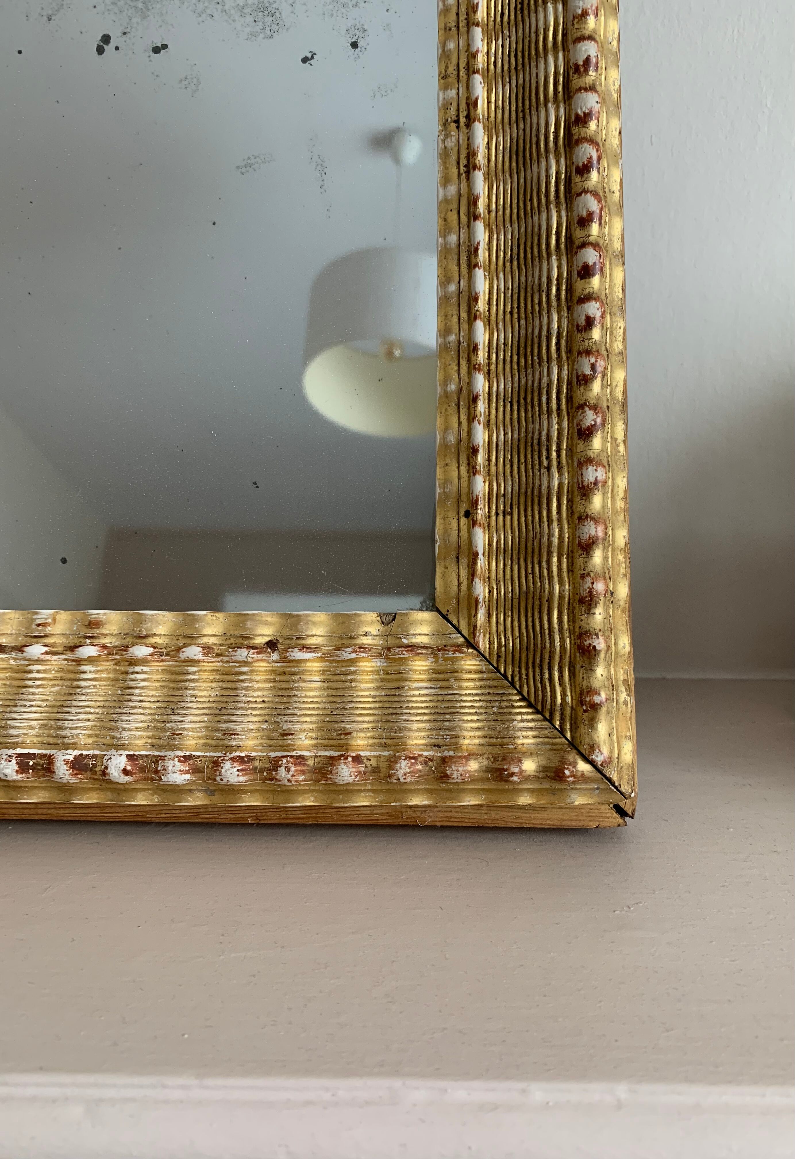 Carved and gilded wooden mirror  44x56cm