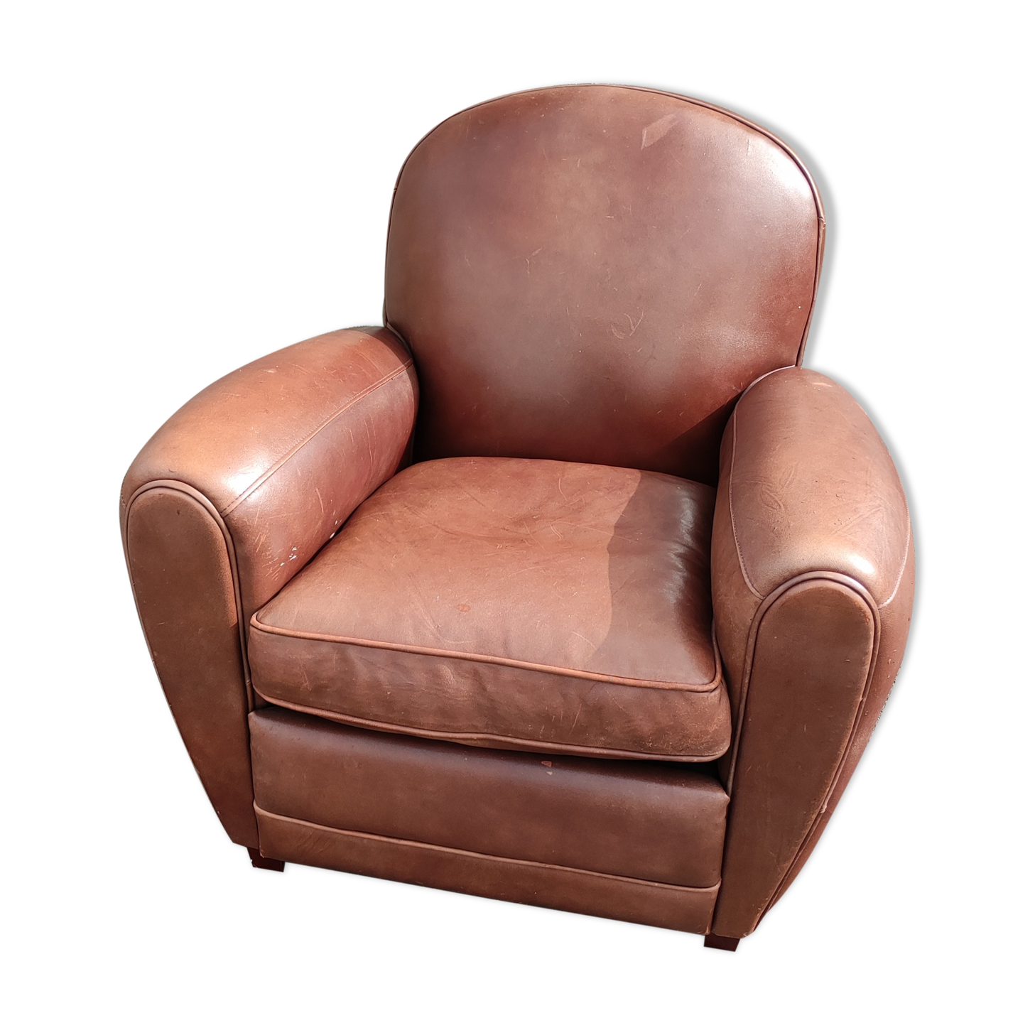 Club chair in brown leather