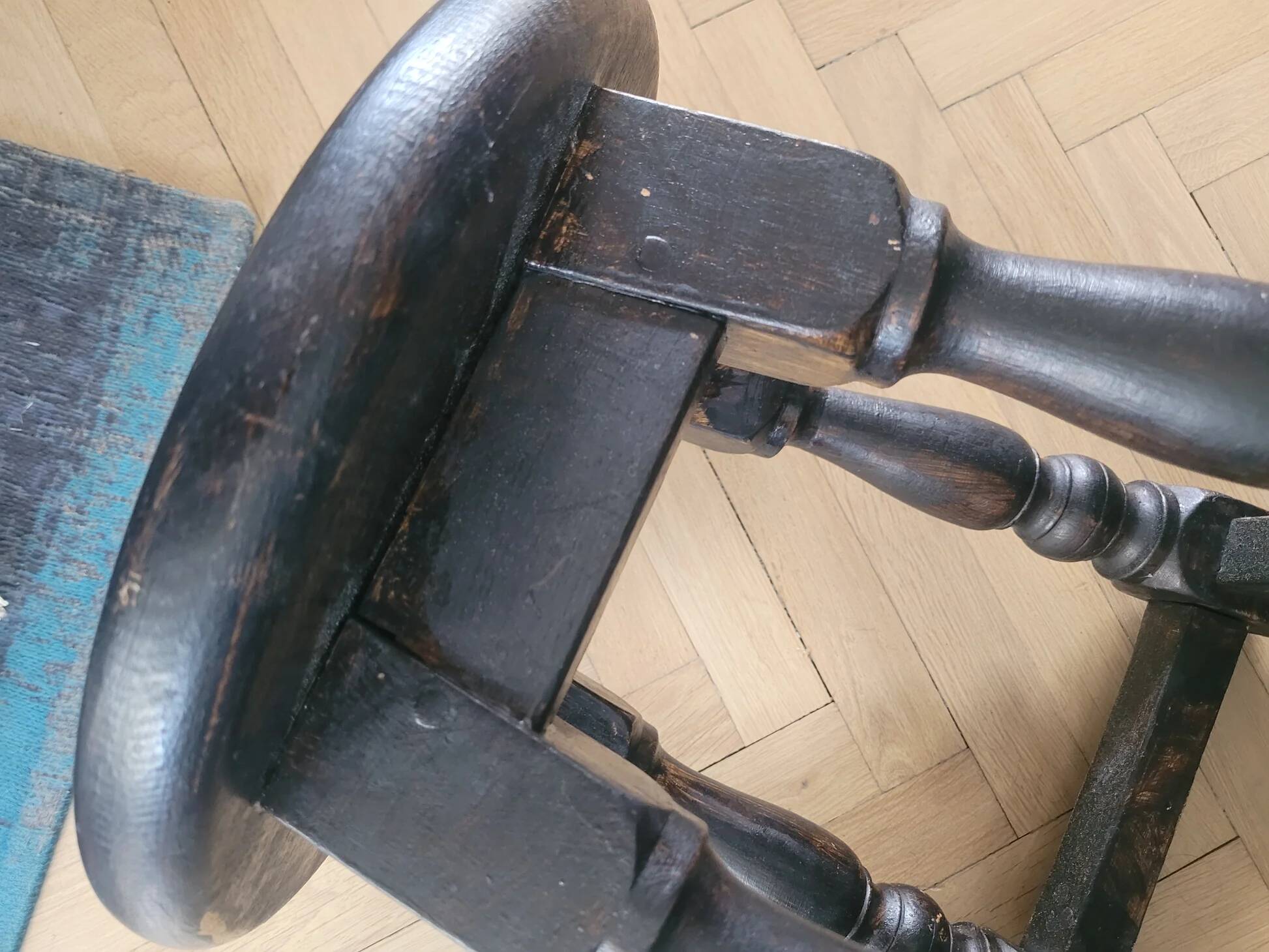 Antique wooden stool with turned legs.