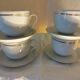 Set de 4 tasses blanches et or en porcelaine