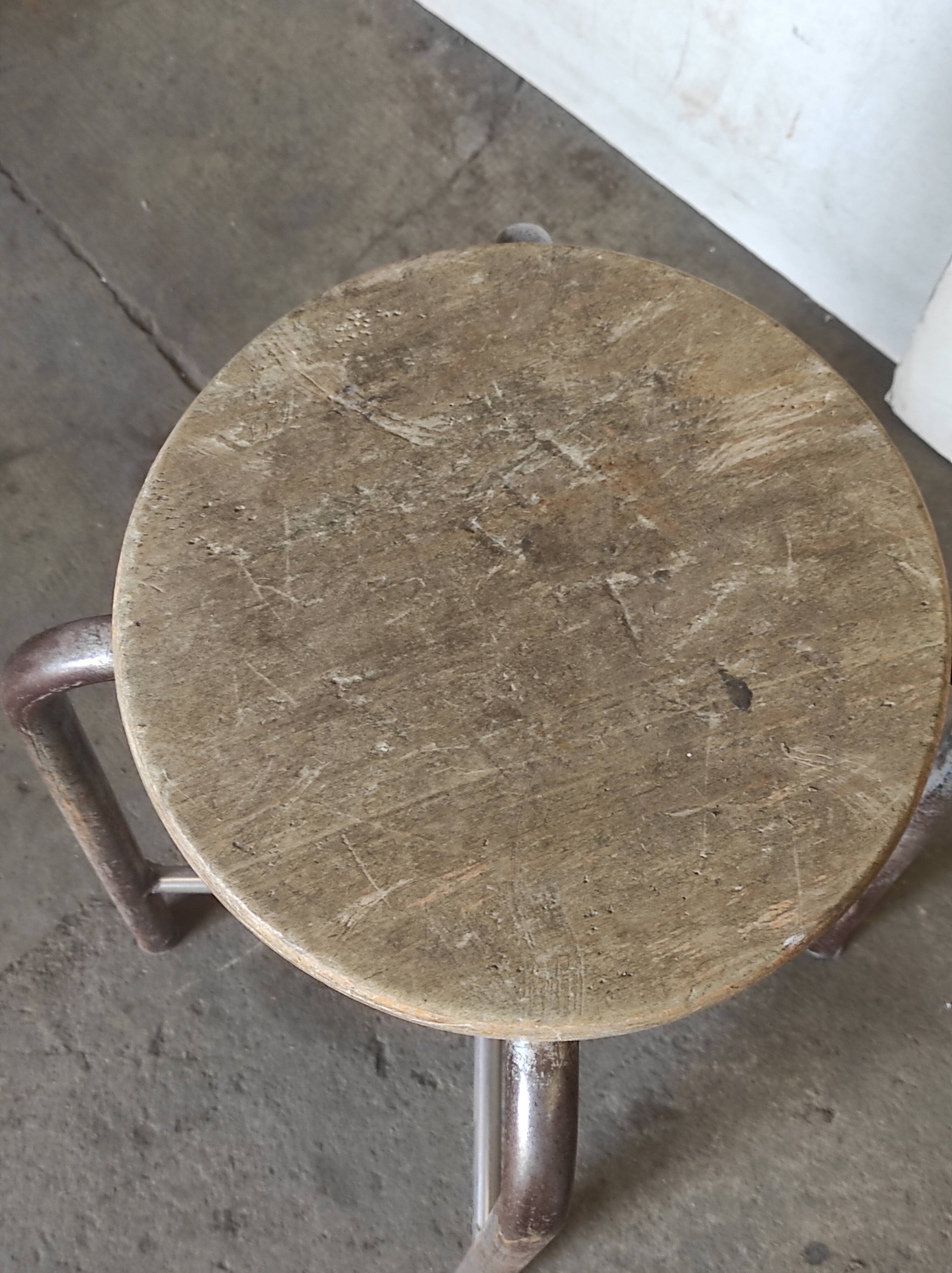 Old vintage metal and wood industrial workshop stool