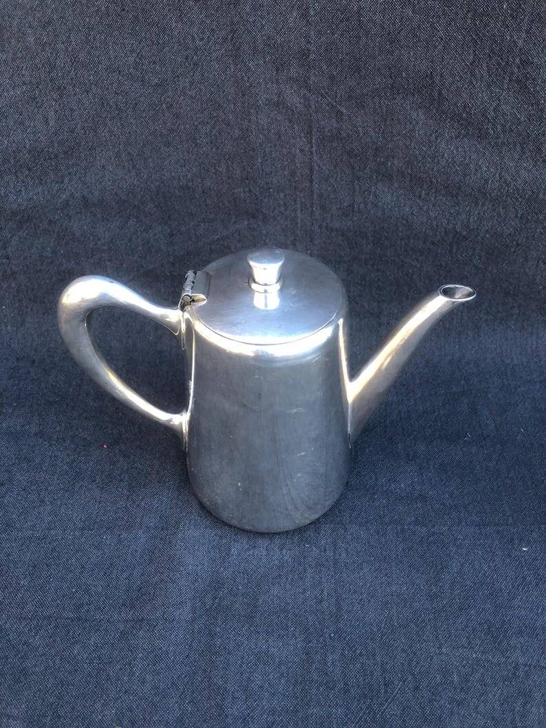 A pair of vintage silver-plated teapot and coffee pot